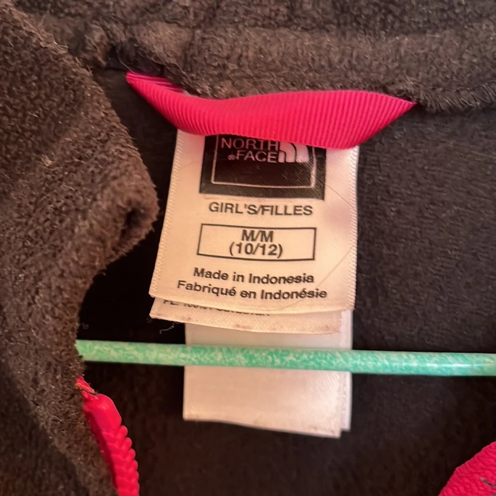 The North Face girls black fleece jacket in size medium 10-12